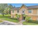 Inviting two-story condo with lush landscaping and well-maintained lawn at 9900 Sweepstakes Ln # 1, Orlando, FL 32837