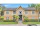 Inviting two-story condo building with lush landscaping and manicured lawn at 9900 Sweepstakes Ln # 1, Orlando, FL 32837