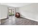 Living room with balcony access, neutral paint, updated flooring, providing a bright and airy atmosphere at 9900 Sweepstakes Ln # 1, Orlando, FL 32837