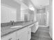 Bathroom with granite countertop vanity, storage, and glass door shower at 3956 Shadowind Way, Gotha, FL 34734
