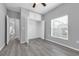 Bedroom with window, wood look flooring, and closet at 3956 Shadowind Way, Gotha, FL 34734