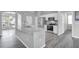 Spacious kitchen island with stainless steel appliances and modern cabinets at 3956 Shadowind Way, Gotha, FL 34734