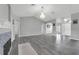 Spacious living room boasts gray floors, ample natural light, and a cozy fireplace at 3956 Shadowind Way, Gotha, FL 34734