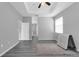 Spacious main bedroom with wood floors, ceiling fan and ensuite access at 3956 Shadowind Way, Gotha, FL 34734