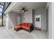 Comfortable outdoor seating area with a ceiling fan within a screened patio at 3956 Shadowind Way, Gotha, FL 34734