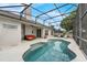 Inviting pool area with a screened enclosure and comfortable seating at 3956 Shadowind Way, Gotha, FL 34734