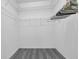 Walk-in closet with wood look floors and wire shelving for storage at 3956 Shadowind Way, Gotha, FL 34734