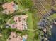Private lakefront estate featuring a pool, lush lawns, and private boat dock at 11103 Bridge House Rd, Windermere, FL 34786