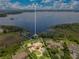 Aerial view showcasing the home's location on a large lot near the lake at 11103 Bridge House Rd, Windermere, FL 34786