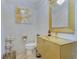 Stylish powder room features a golden sink and decorative gold accents for a luxurious touch at 11103 Bridge House Rd, Windermere, FL 34786