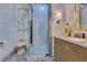 Stylish bathroom featuring mosaic tile shower, modern vanity, and unique artistic accents at 11103 Bridge House Rd, Windermere, FL 34786