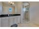 Modern bathroom with glass-enclosed shower, sleek vanity, and contemporary design at 11103 Bridge House Rd, Windermere, FL 34786