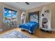 Unique ' bedroom with custom space-themed bed frame and plenty of natural light at 11103 Bridge House Rd, Windermere, FL 34786