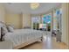 Bright bedroom with large windows, hardwood floors, and neutral décor at 11103 Bridge House Rd, Windermere, FL 34786
