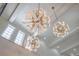 Luxurious ceiling details with decorative chandeliers and recessed lighting at 11103 Bridge House Rd, Windermere, FL 34786