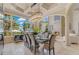 Dining area boasting lake views, designer lighting, and a stylish table setting at 11103 Bridge House Rd, Windermere, FL 34786