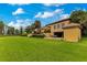 Large estate home with meticulously maintained lawn and landscaping, providing a serene outdoor setting at 11103 Bridge House Rd, Windermere, FL 34786