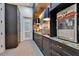 Hallway with a built-in bar, a popcorn machine, ample storage, and tasteful decor at 11103 Bridge House Rd, Windermere, FL 34786