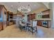 Gourmet kitchen featuring a center island, modern lighting, and ample cabinet space at 11103 Bridge House Rd, Windermere, FL 34786