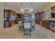Spacious kitchen features a large center island, stainless steel appliances, and dark wood cabinets at 11103 Bridge House Rd, Windermere, FL 34786