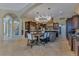 Expansive open kitchen features a large island, stainless appliances, and tile flooring at 11103 Bridge House Rd, Windermere, FL 34786