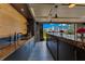 Modern kitchen featuring an island, granite countertops, and a seamless indoor-outdoor transition to a beautiful backyard at 11103 Bridge House Rd, Windermere, FL 34786