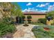 Beautifully landscaped yard with manicured gardens, stone pathway, and decorative fountain, enhancing outdoor appeal at 11103 Bridge House Rd, Windermere, FL 34786
