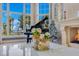 Living room with a piano near a grand window overlooking the lake at 11103 Bridge House Rd, Windermere, FL 34786