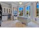 Bright office space features large windows, custom built-ins, and a unique mirrored desk at 11103 Bridge House Rd, Windermere, FL 34786