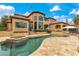 Backyard featuring a pool and spa, complemented by landscaped garden and outdoor seating areas at 11103 Bridge House Rd, Windermere, FL 34786