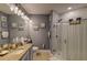 Bathroom featuring a tiled shower with glass door at 114 Vista Verdi Cir # 116, Lake Mary, FL 32746