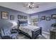 Cozy bedroom with natural light, ceiling fan, and wood-look floors at 114 Vista Verdi Cir # 116, Lake Mary, FL 32746