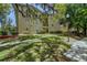 Apartment building with manicured landscaping and mature trees at 114 Vista Verdi Cir # 116, Lake Mary, FL 32746