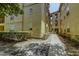 Exterior view of an apartment building with a courtyard at 114 Vista Verdi Cir # 116, Lake Mary, FL 32746