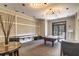 A well-appointed game room features a pool table, stylish lighting, comfortable seating, and contemporary decor at 114 Vista Verdi Cir # 116, Lake Mary, FL 32746