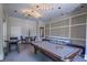 This modern game room features a pool table, stylish lighting, comfortable seating, and contemporary decor at 114 Vista Verdi Cir # 116, Lake Mary, FL 32746