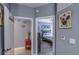 Hallway leading to a bedroom with a ceiling fan and comfortable furnishings at 114 Vista Verdi Cir # 116, Lake Mary, FL 32746