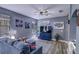 Inviting living room boasts a plush sofa, stylish rug, blue media center, and plenty of natural light at 114 Vista Verdi Cir # 116, Lake Mary, FL 32746