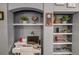 Custom built-in shelving with decorative accents in home office space at 114 Vista Verdi Cir # 116, Lake Mary, FL 32746