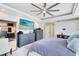 Bedroom featuring tray ceilings, fan, and dresser at 1154 Kerwood Cir, Oviedo, FL 32765