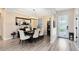 Formal dining room featuring hardwood floors, elegant lighting, and stylish decor at 1154 Kerwood Cir, Oviedo, FL 32765