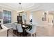 Formal dining room featuring hardwood floors, elegant lighting, and stylish decor at 1154 Kerwood Cir, Oviedo, FL 32765