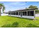 This lovely home has an expansive screened-in porch and a well-manicured lawn, ready for outdoor enjoyment at 1154 Kerwood Cir, Oviedo, FL 32765