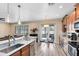 Modern kitchen featuring stainless steel appliances, granite countertops, and barstool seating at 1154 Kerwood Cir, Oviedo, FL 32765