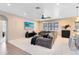 Cozy living room featuring an entertainment system and a view into the bright kitchen at 1154 Kerwood Cir, Oviedo, FL 32765