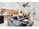 Spacious living room with plush seating and open access to the kitchen and dining areas at 1154 Kerwood Cir, Oviedo, FL 32765