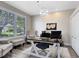 Bright office space with ample natural light, a modern desk, and comfortable seating at 1154 Kerwood Cir, Oviedo, FL 32765