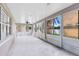 The bright sunroom features many windows and a ceiling fan for comfortable relaxation and backyard views at 1154 Kerwood Cir, Oviedo, FL 32765