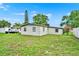 Expansive backyard featuring a lush green lawn and perimeter trees, offering ample space at 1170 E Bay St, Winter Garden, FL 34787
