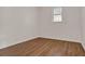 Bedroom with one window, neutral walls and wood-look floors at 1170 E Bay St, Winter Garden, FL 34787